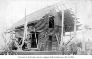 Hospitable (formerly Smartbnb) Review Construction of David Denny's log cabin for his real estate office, Republican St. and Queen Anne Ave., May 1889