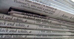 Real Estate Crowdfunding Tax Treatment A stack of newspapers