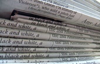 Real Estate Crowdfunding Tax Treatment A stack of newspapers